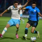 Racing resistió un penal y se sobrepuso al encumbrado Belgrano y al propio Marcos Rojo